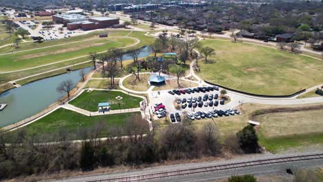 Aerial-footage-of-Unity-Park,-K9-Kastle,-Kids-Kastle-and-ponds-in-Highland-Village-Texas