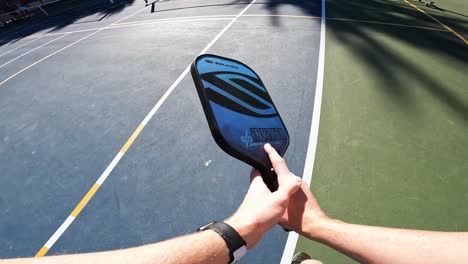 Pickleball-Player-Serving-the-Ball-on-Outdoor-Court