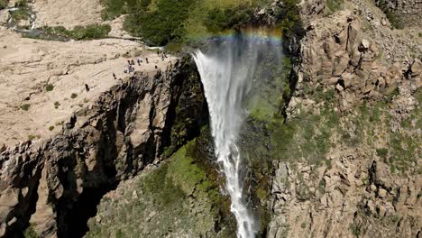 Aerial-view-of-a-crane-shot-of-the-inverted-waterfall-or-rainbow-waterfall-that-due-to-the-action-of-the-wind-generates-a-rainbow-and-the-water-that-goes-against-its-course