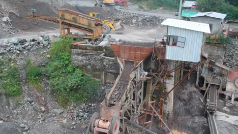 Conveyor-belts-and-stone-crushers-in-sand-quarry-in-Magelang,-Indonesia,-aerial
