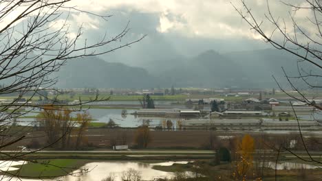 Sun-Beams-Through-Clouds-Passing-Flooded-Landscape-Of-Abbotsford-In-British-Columbia