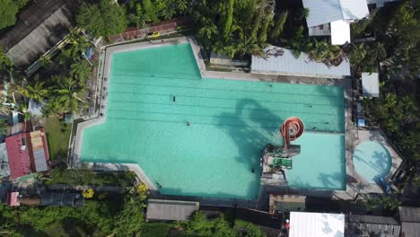 High-Angle-Video-view-of-Family-Enjoying-Backyard-Swimming-Pool