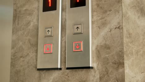 Woman's-Hand-Pressing-Elevator-Button-By-Using-Key-During-Covid-19-Time