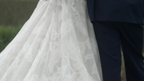 Bride-in-wedding-dress-and-groom-in-suit