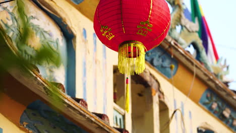 Red-Chinese-Lantern-Hung-Outside-A-Building-In-Phan-Thiet,-Vietnam-At-Daytime