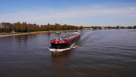 Aerial-Circle-Dolly-Around-Forward-Bow-Of-Da-Vinci-Motor-Tanker-Ship-Navigating-Along-Oude-Maas
