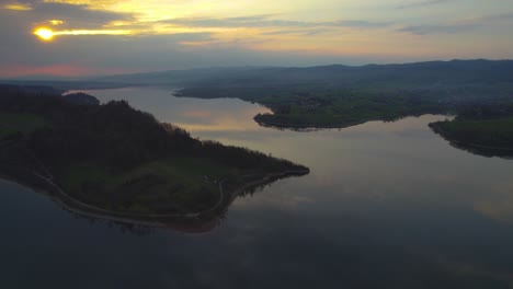 Cloud-Reflection-in-Lake-Czorsztyn-in-Poland,-Beautiful-Sunset-at-Dusk