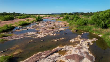 Aerial-footage-of-the-popular-area-on-the-Llano-River-in-Texas-called-The-Slab