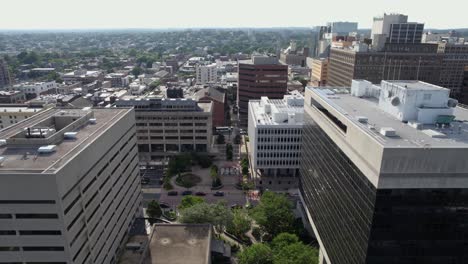 Aerial-view-in-middle-of-buildings-in-the-city-centre-of-Wilmington,-Delaware,-USA---pull-back,-drone-shot