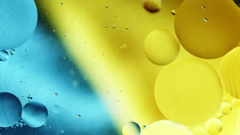 Real-close-up-oil-bubbles-in-water-rotation-with-color-gradient-abstract-mixing-background