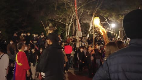 Flaming-Torch-Parade-leading-to-burning-event-at-Sagicho-Matsuri-at-night-4k