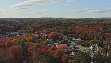 Wells-Maine-Aerial-v13-cinematic-drone-flyover-beautiful-rural-countryside-town-surrounded-by-colorful-autumn-trees-during-tranquil-fall-season---October-2020