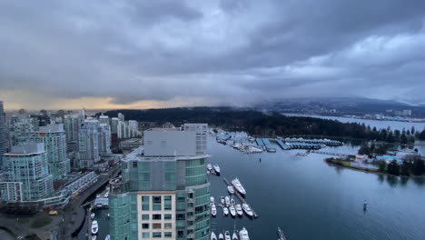View-of-a-stormy-weather-over-Vancouver-harbor,-Canada,-with-ships-passing-by