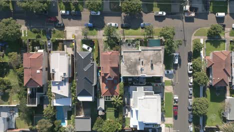 Aerial-top-down-view-of-houses-and-streets-in-beautiful-residential-neighbourhood-during-fall-season-in-Sydney,-New-South-Wales,-Australia