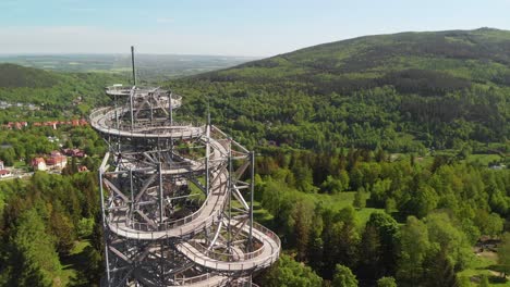 Aerial-orbit-over-the-observation-tower-with-stunning-Sudety-mountains-panorama