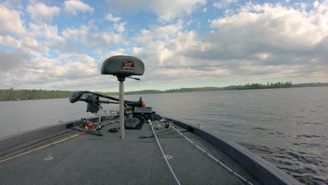 Front-end-of-bass-fishing-boat-while-floating-in-Wakemup-Bay-of-Lake-Vermilion-on-a-cloudy-summer-day-in-northern-Minnesota