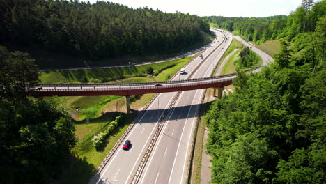 Aerial-view-of-Cars-Traffic-on-Countryside-Curved-Highway-with-bridge-intersection