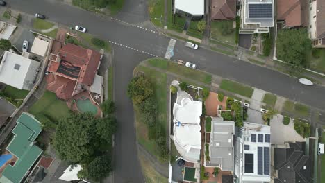 Top-down-aerial-of-a-quiet-residential-properties-and-town-houses-street-intersections