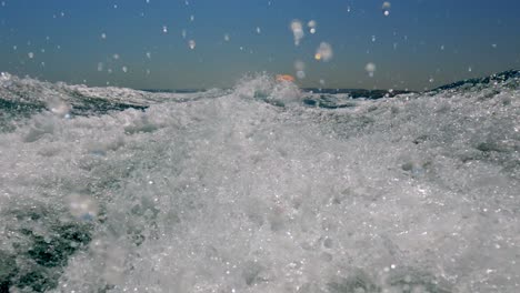 Extreme-and-unique-low-angle-pov-of-speed-boat-water-wake