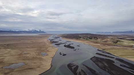 Aerial-view-of-a-diverging-glacial-river-system-in-Iceland-in-an-amazing-landscape
