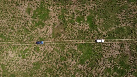 Overhead-shot-of-4x4-vehicles-passing-through-an-off-road-route