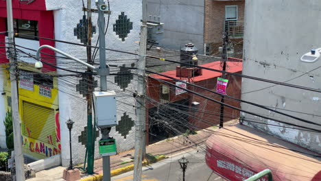 Close-Up-View-Of-Powerlines-Crossing-Empty-Street-In-Mexcio-City