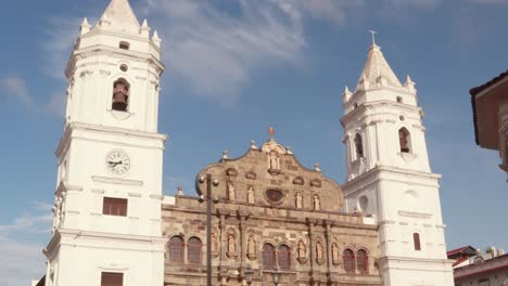 An-establishing-shot-tilting-up-to-reveal-the-beautiful-facade-of-the-Metropolitan-Cathedral,-spectacular-Roman-Catholic-architecture-and-a-National-historical-landmark,-Casco-Viejo,-Panama-City