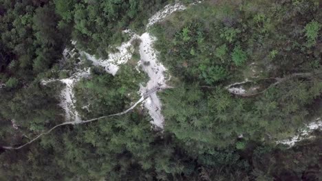 Aerial-top-view-of-Sugana-Valley,-with-drone-rotating-while-descending