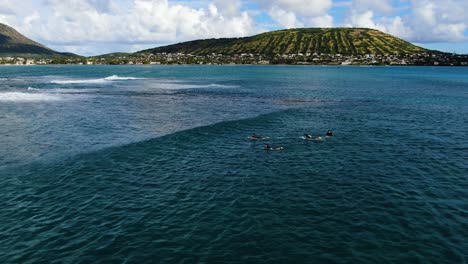 parallax-shot-of-surfers-paddling-for-a-wave-and-missing