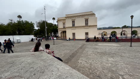 Shot-of-two-indigenous-woman-seaten-at-San-cristobal-de-las-Casas-main-plaza-at-chiapas-mexico