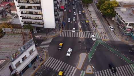 Aerial-approaching-view-of-vehicles-diverting-at-intersection-at-Cordoba-Avenue-fork-in-Buenos-Aires