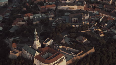 Aerial-view-of-Nitra-Historic-Castle-and-old-town-at-sunset