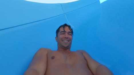 A-video-of-a-guy-going-down-a-waterslide