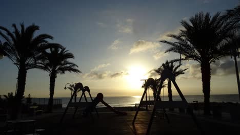 Children-playground-in-front-of-the-beach-at-sunrise-time