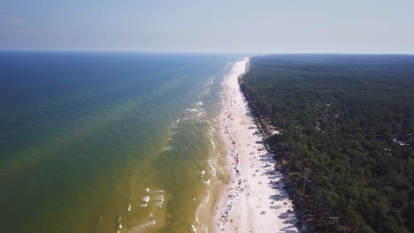 Drone-footage-of-a-sandy-beach,-sunny-summer-day,-Baltic-Sea,-Poland,-Lubiatowo