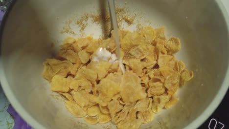 Pouring-Milk-ontop-of-Cornflakes