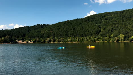 Clip-of-two-single-kayaks-while-sailing-in-the-Pancharevo-Lake,-Bulgaria