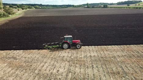 Aerial-footage-over-tractor-ploughing-field