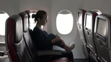 Girl-Stretching-in-plane