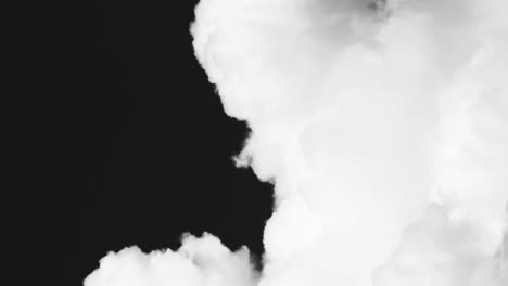 Clouds-rising,-vertical-footage-black-and-white