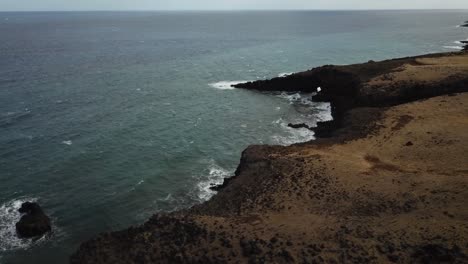 Drone-shot-of-cliffside-beach