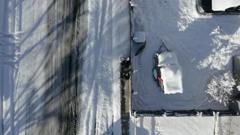 Aerial-top-view-of-man-using-snowblower