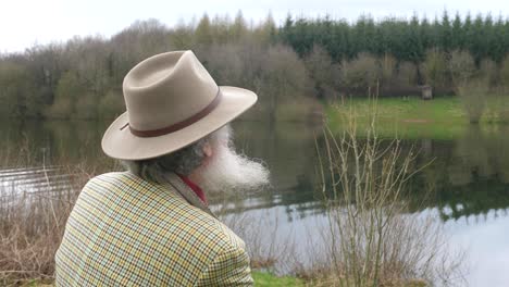 An-elderly-man-looking-out-over-the-lake-thinking-about-history