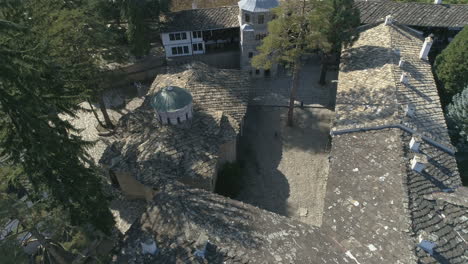 View-over-the-rooftops-of-the-Troyan-Monastery-in-Bulgaria,-aerial-footage