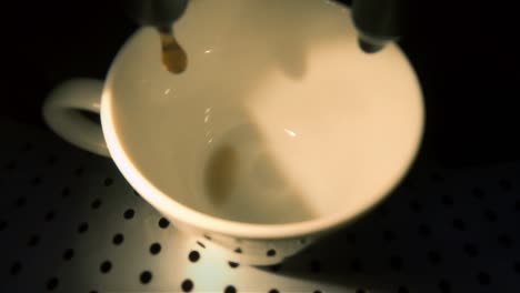 Home-coffee-machine-making-espresso-in-medium-cup