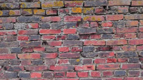 old-brick-wall-in-exterior-panning-from-left-to-right-uninterrupted