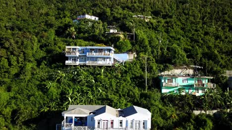 Aerial-crane-shot-of-local-homes-on-a-hillside-on-BVI-island-Tortola