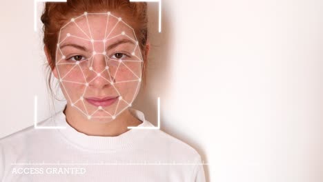 Close-up-of-a-young-woman-with-red-hair,-with-a-white-shirt-on-a-white-background,-with-facial-recognition-high-tech-animation-with-tracking-points-and-a-glow-effect-on-her-face,-with-"access-granted