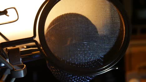 Slow-zoom-out-from-close-up-of-studio-microphone