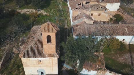 Aerial-view-of-an-abandoned-village-with-a-church-in-Spain